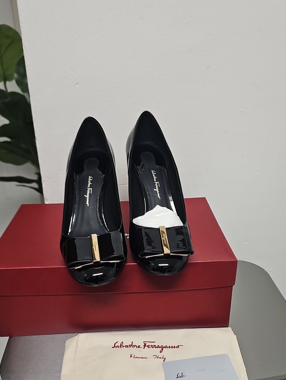 Salvatore Ferragamo Black Patent Vara Bow Pumps with Gold Accent